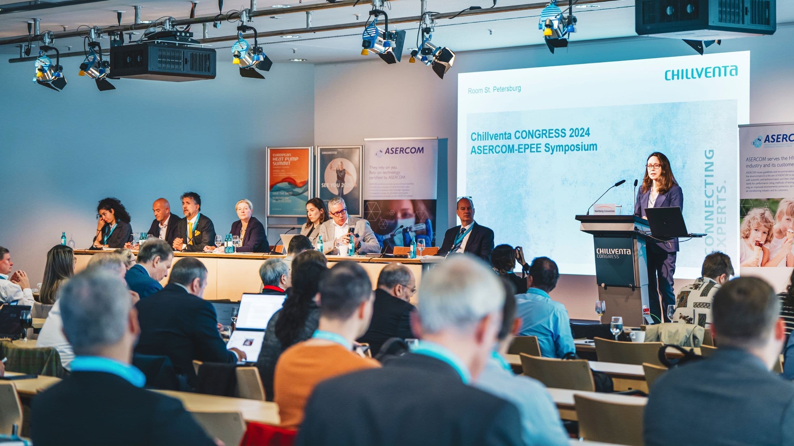 A view of a congress during Chillventa. A woman stands on the podium and speaks to the audience.