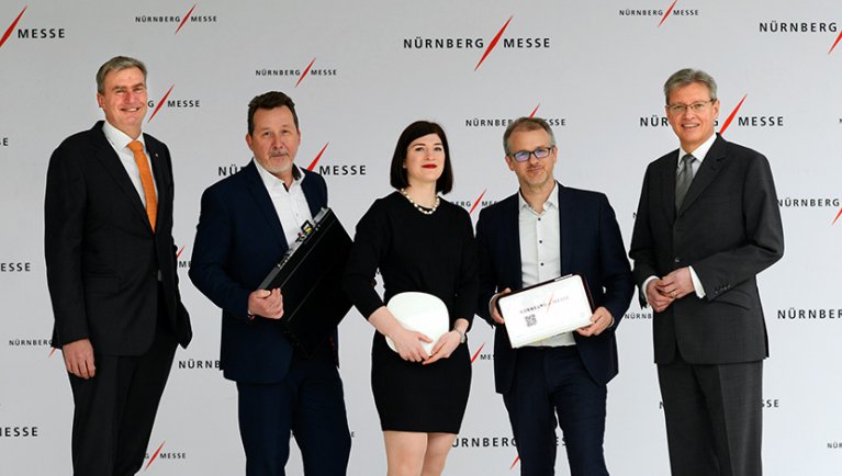 NürnbergMesse CEOs Peter Ottmann and Dr Roland Fleck with the new partners Christoph Bünnemeyer, Axians Networks & Solutions GmbH; Elisabeth Berg, Aruba, and Johannes Bisping, bisping & bisping